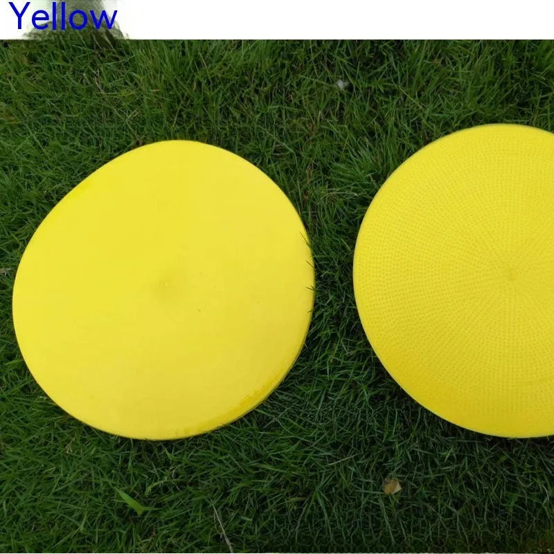 Soft yellow TPE football training disc on grass, showing 23cm diameter flat marker.
