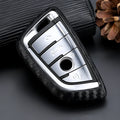 Carbon fibre silicone key case cover for blade-style car keys with impact cushioning and precise button cutouts