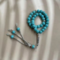 Handmade Muslim worship bracelet with sky blue 8mm stone beads for daily dhikr reminders.
