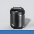 Black portable Bluetooth speaker with compact plastic cabinet, showing front speaker grille and control panel.