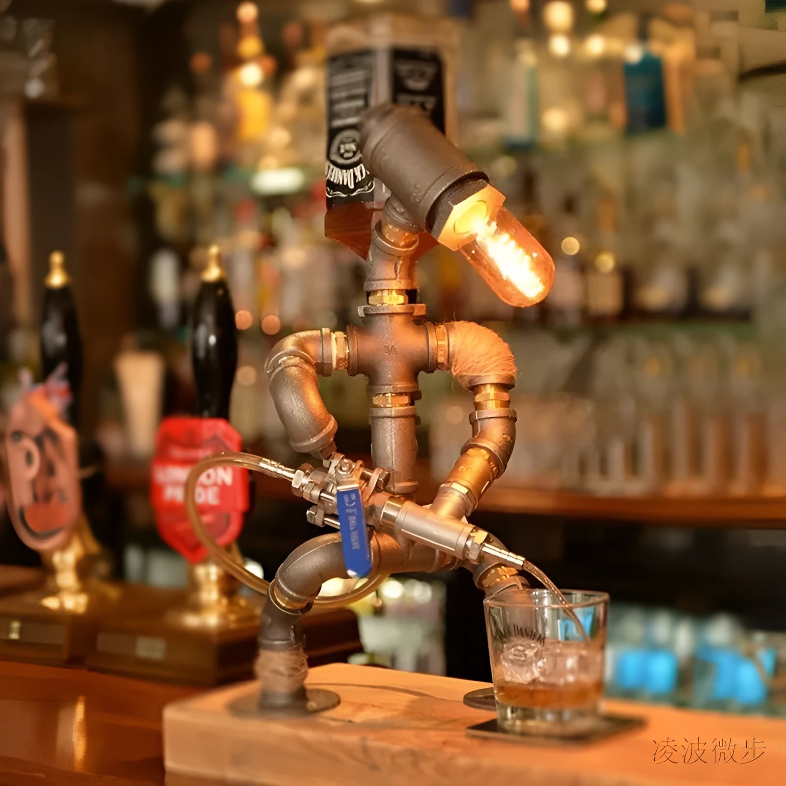 Industrial retro style table lamp made from iron pipes with a robot figure detail, in a vintage finish.