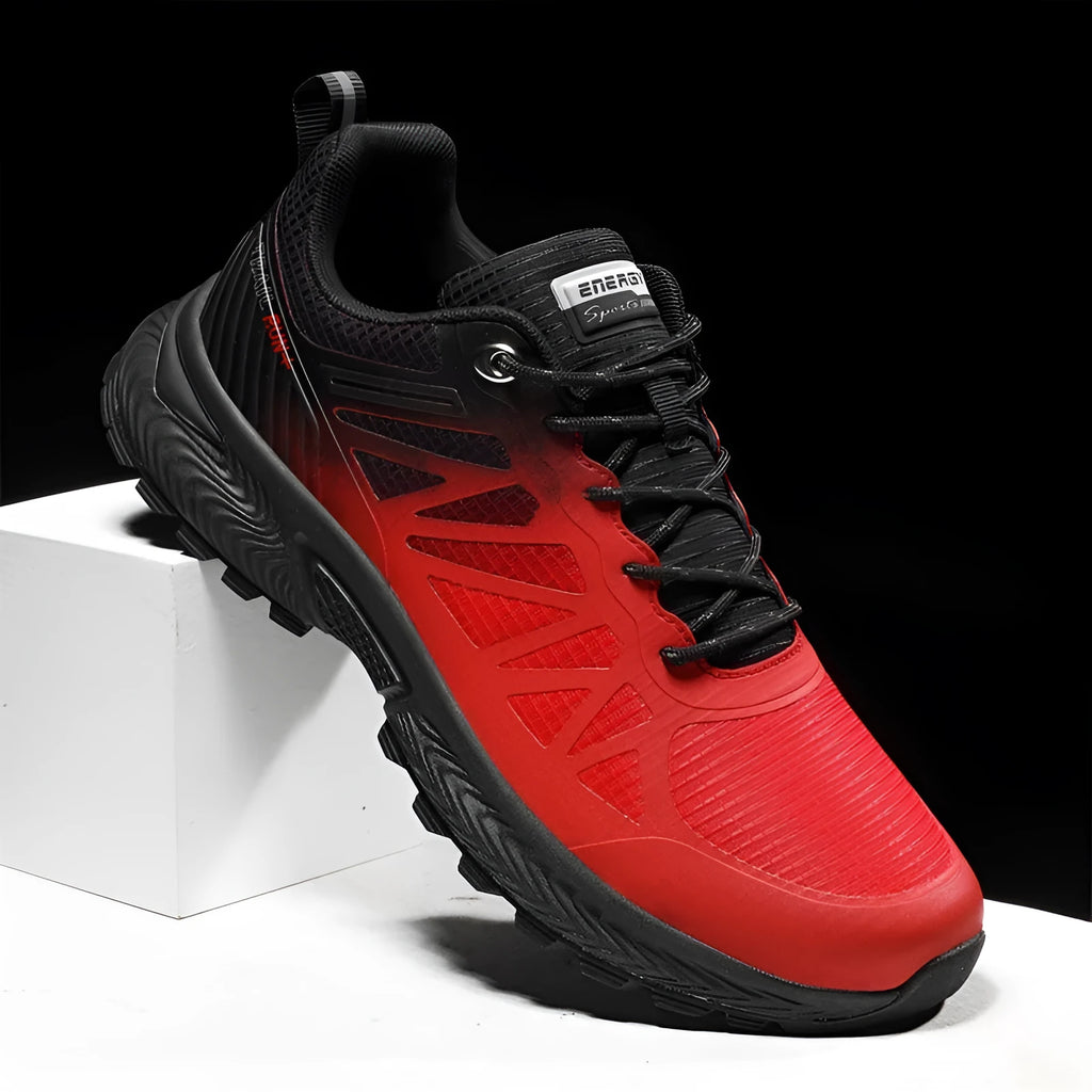 Men's black and orange breathable mesh running shoe with lace-up front and rubber sole, shown in plus sizes.