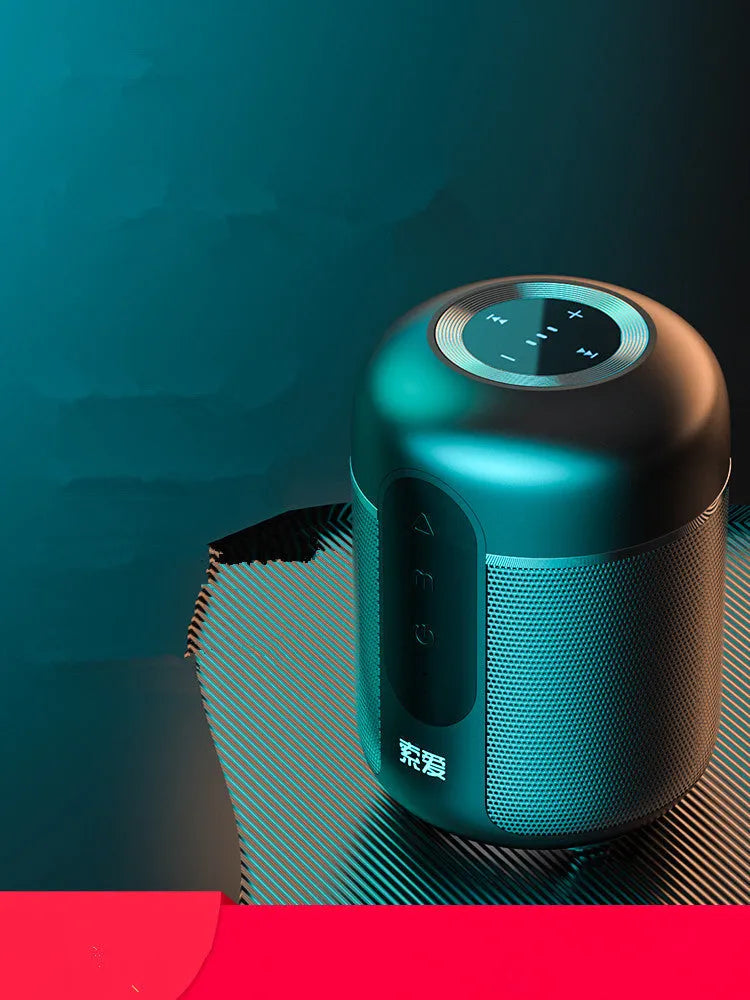 Black portable Bluetooth speaker with compact plastic cabinet, showing front speaker grille and control panel.
