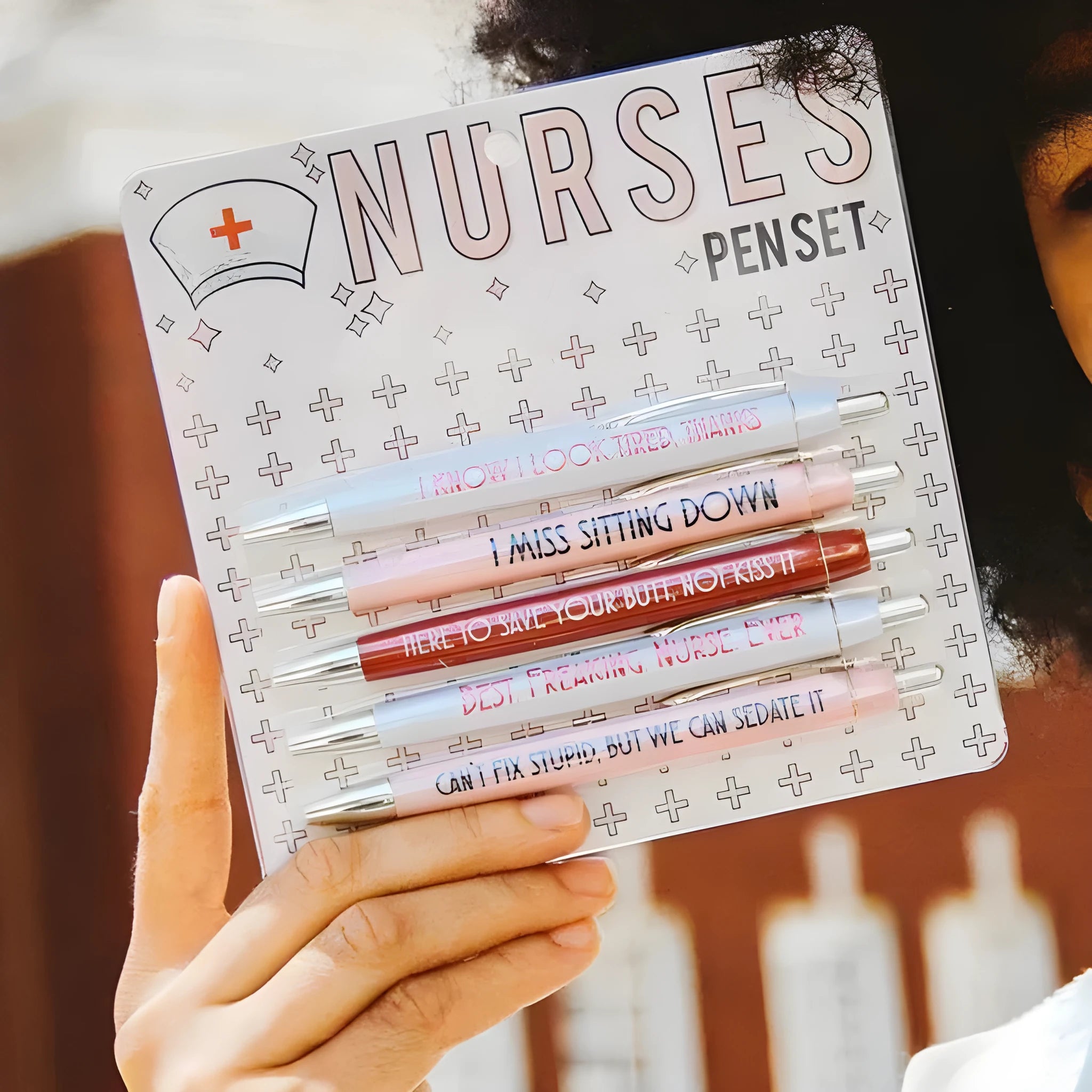 Five nurse-themed plastic ballpoint pens with retractable tips, measuring 14cm in length