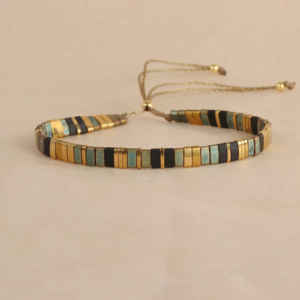 Adjustable glass beaded bracelet in geometric design with round beads available in five colours