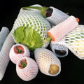 White foam protective net sleeve for fruit and delicate items, shown in multiple sizes.