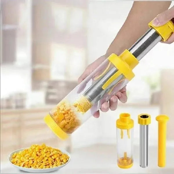 Yellow cylindrical corn stripper kitchen tool with stainless steel mechanism on a wooden surface.