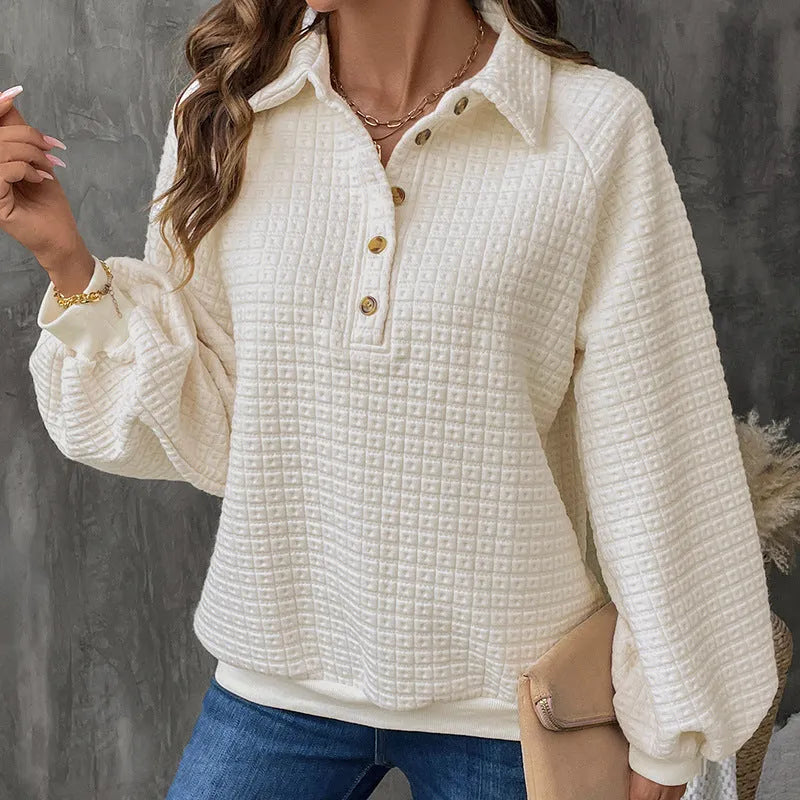 Women's beige polo neck thick polyester sweater on a hanger