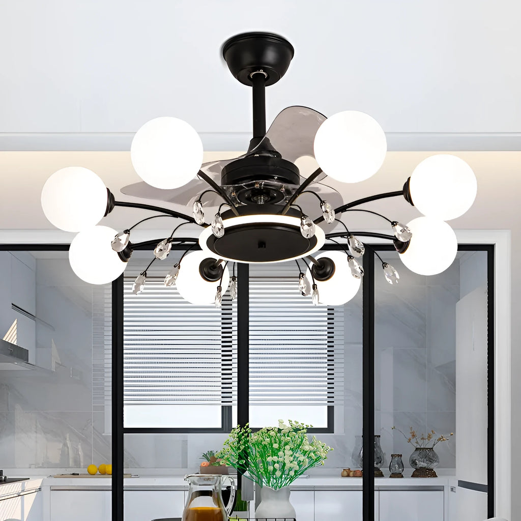 Gold and black ceiling fan lamp with chandelier style lights and metal blades.