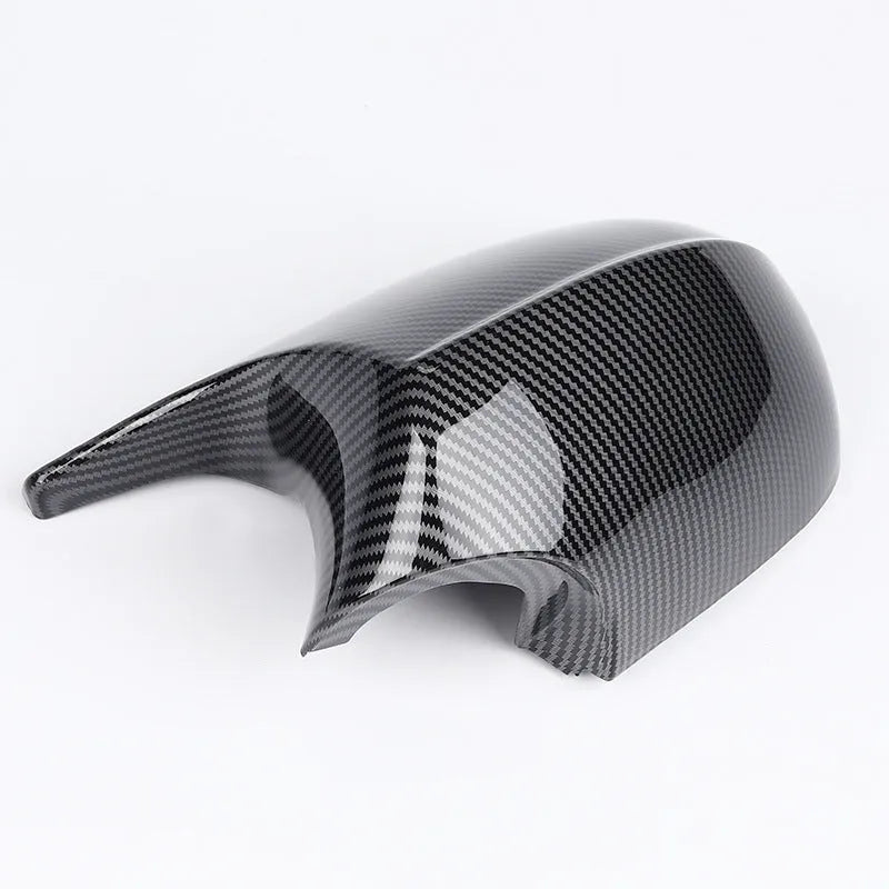 Pair of BMW 3 Series E90 ABS plastic rearview mirror housings in black and carbon pattern finishes