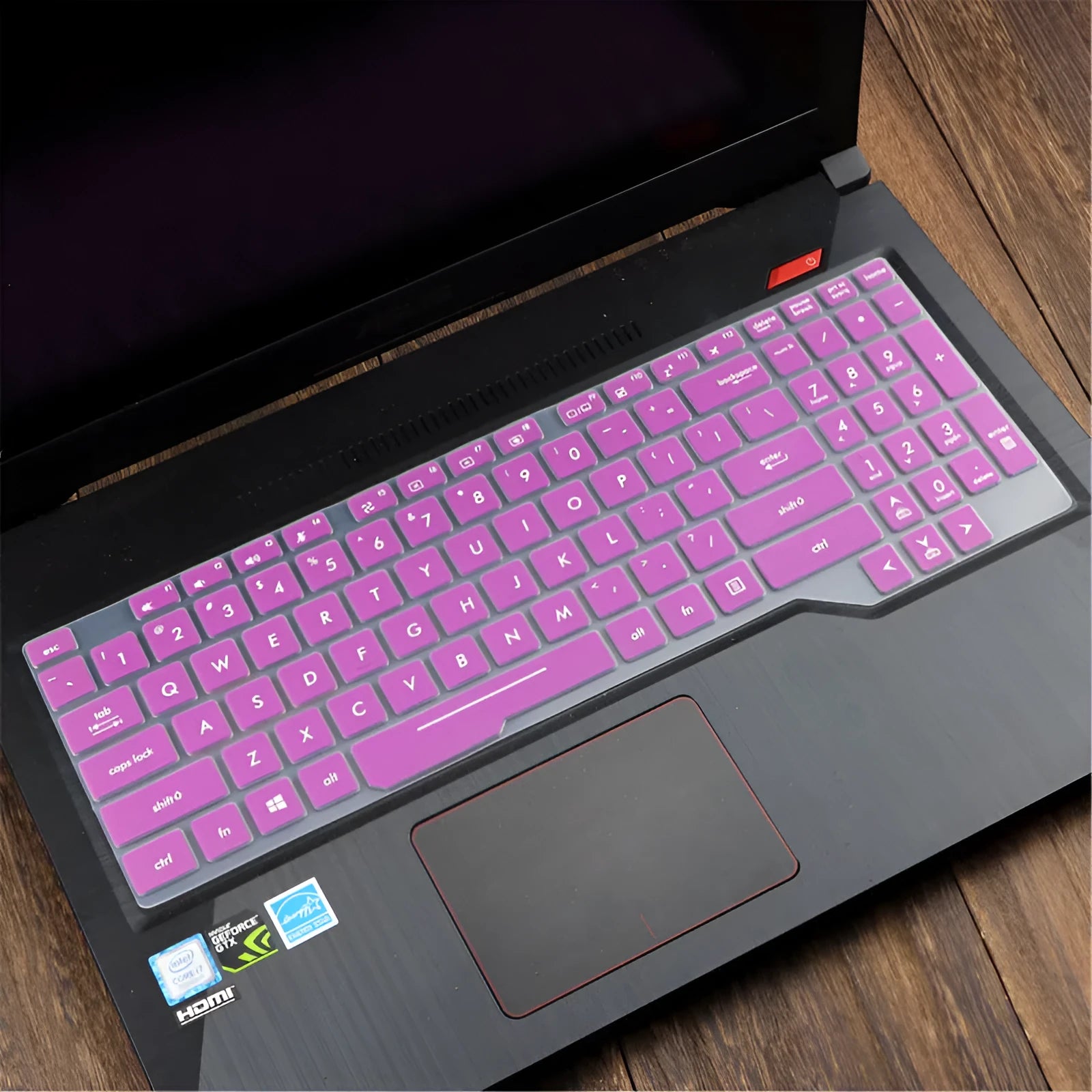 ASUS VivoBook 15 X513 laptop with a translucent mint coloured silicone keyboard protector fitted.