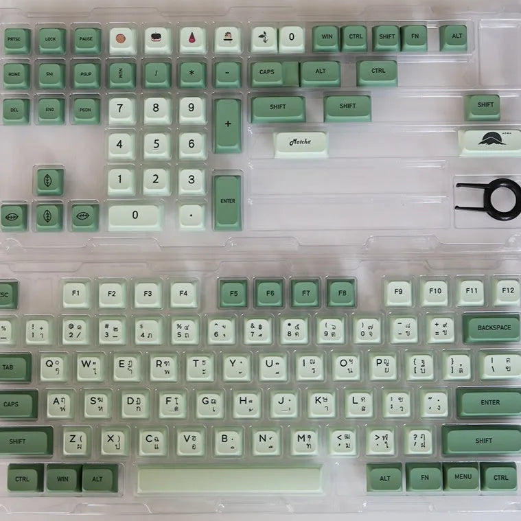 Full set of 124 matcha green PBT keycaps for a mechanical keyboard, showing various international layout options.