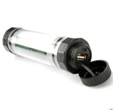 Large black plastic 1000 litre garden water butt or rain barrel with a silver tap fitting.
