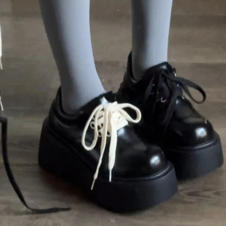 Women's matte black lace-up shoes with thick rubber sole and chunky 6-8cm heel, round toe.