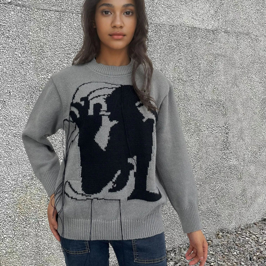 Women's loose grey alpaca wool sweater with tassel design and abstract pattern