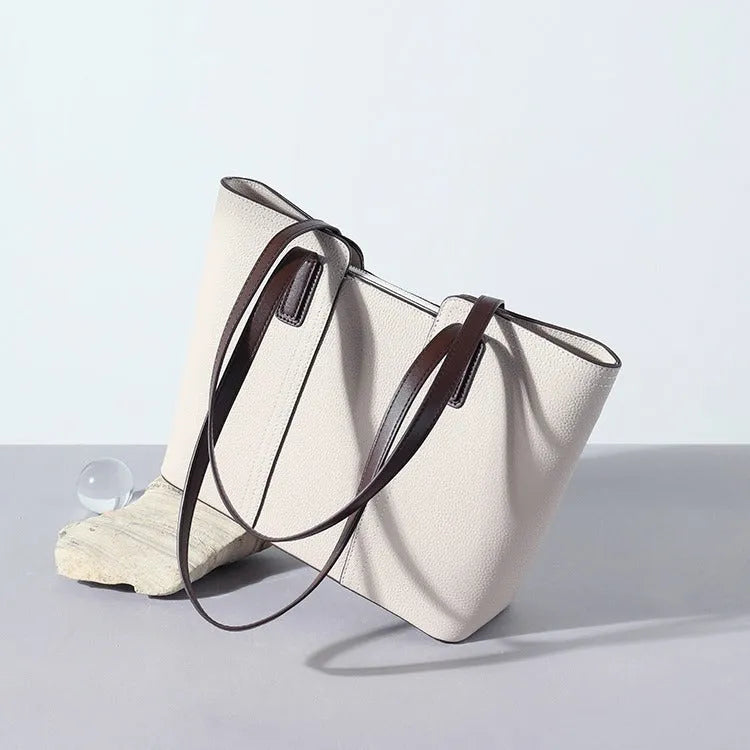 Genuine leather box-type shoulder bag in khaki colour with a sewing line detail and sandwich pocket.
