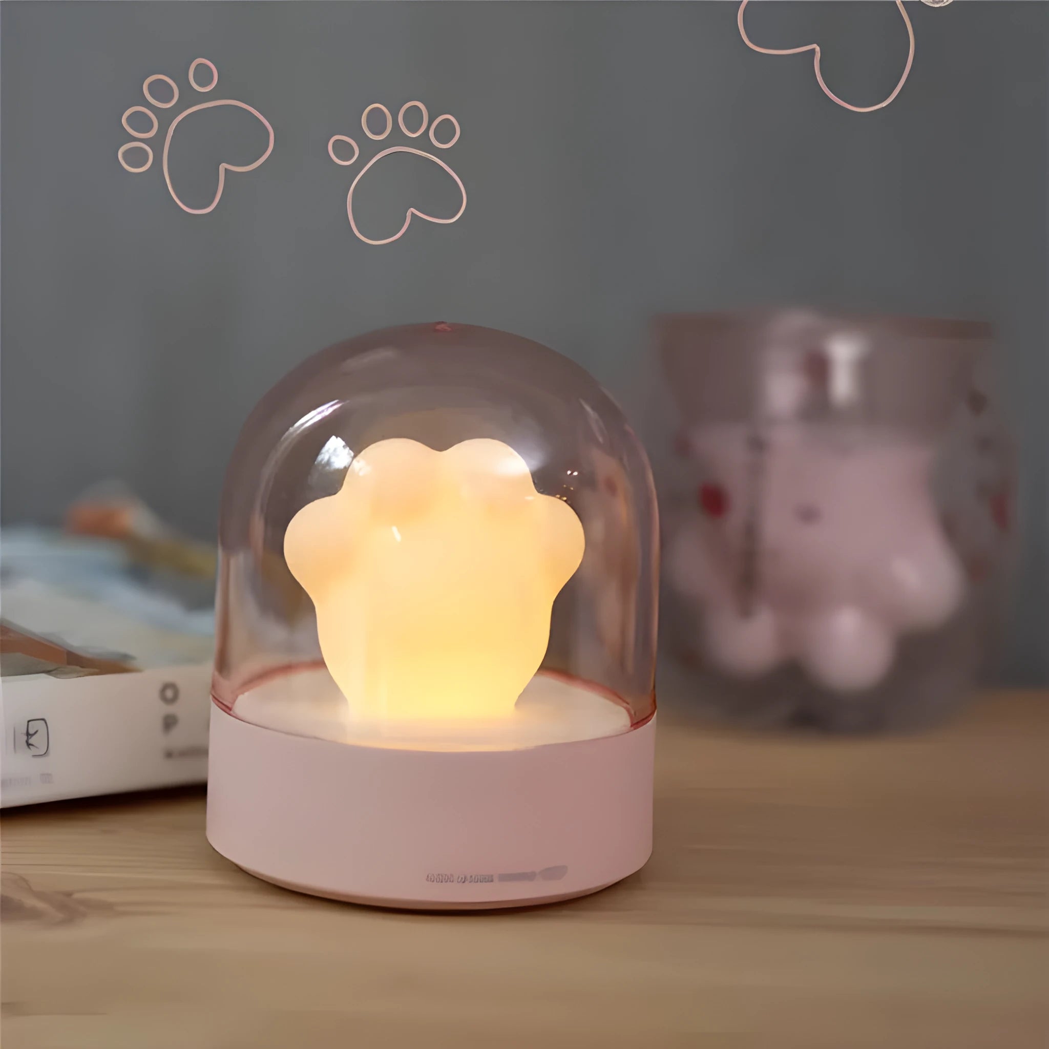 Cat paw-shaped night light with music box function showing pink colour option with illuminated soft light