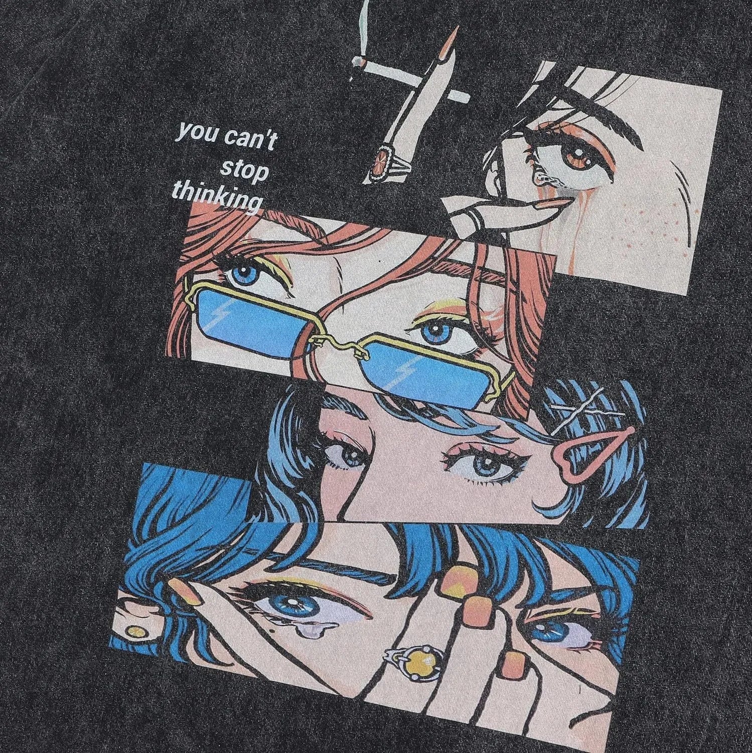 Man wearing a black cotton T-shirt with a cartoon print, showing loose fit and short sleeves.