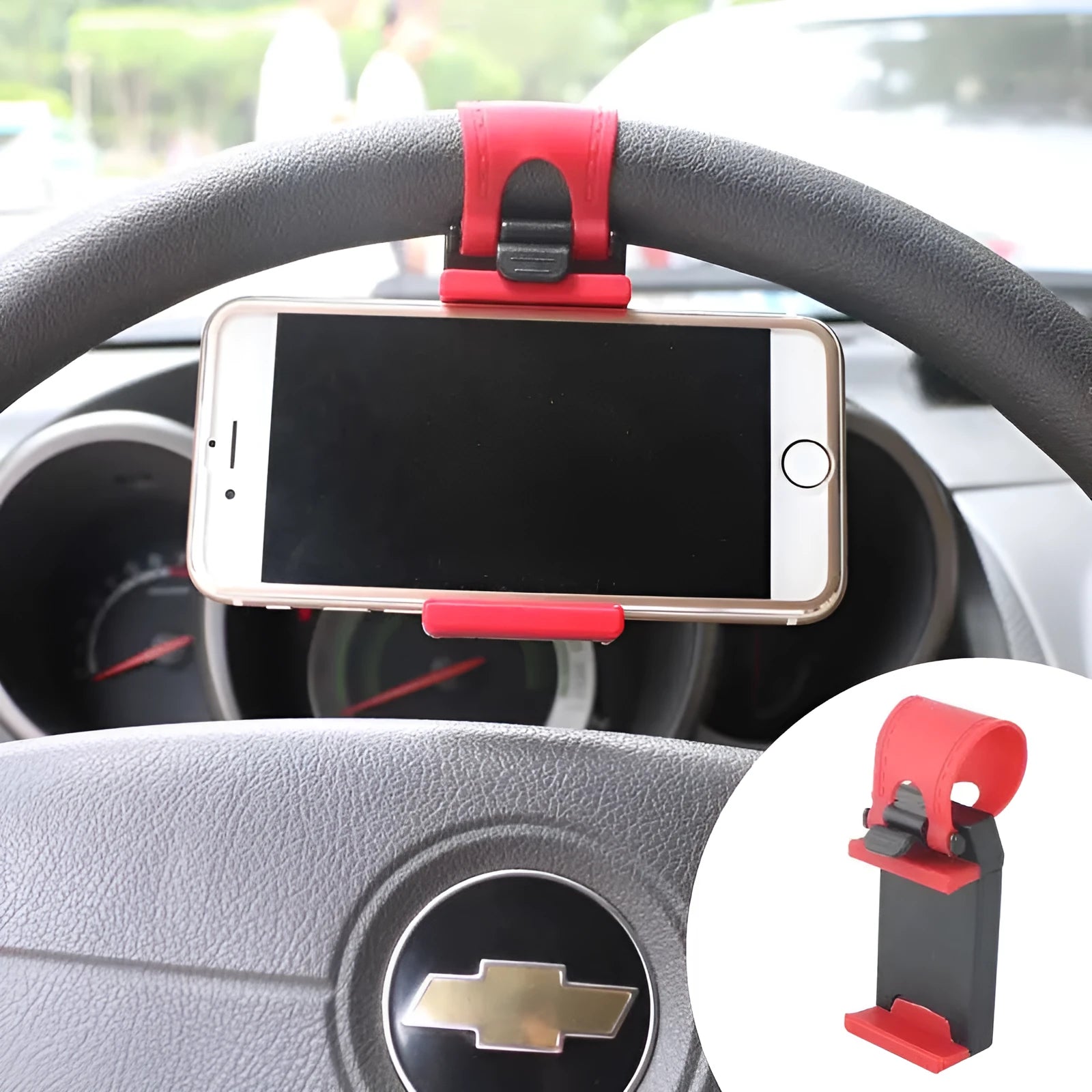 Black universal steering wheel phone holder clip mounted on a car steering wheel.