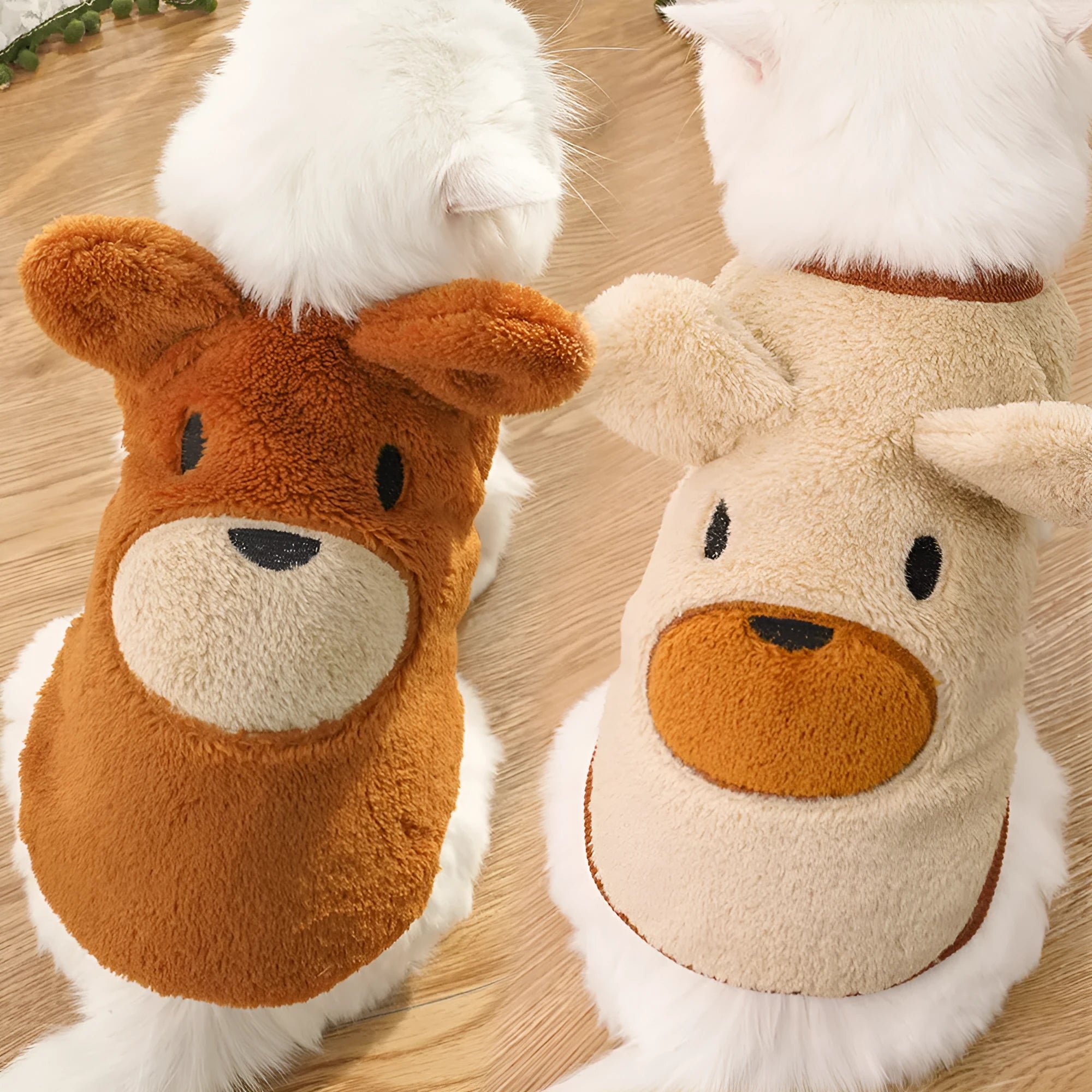 Fleece-lined warm polyester dog coat in cream with bear ears, lying flat showing size tag
