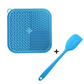 Orange and grey silicone dog lick mat with textured surface and suction cups on reverse side