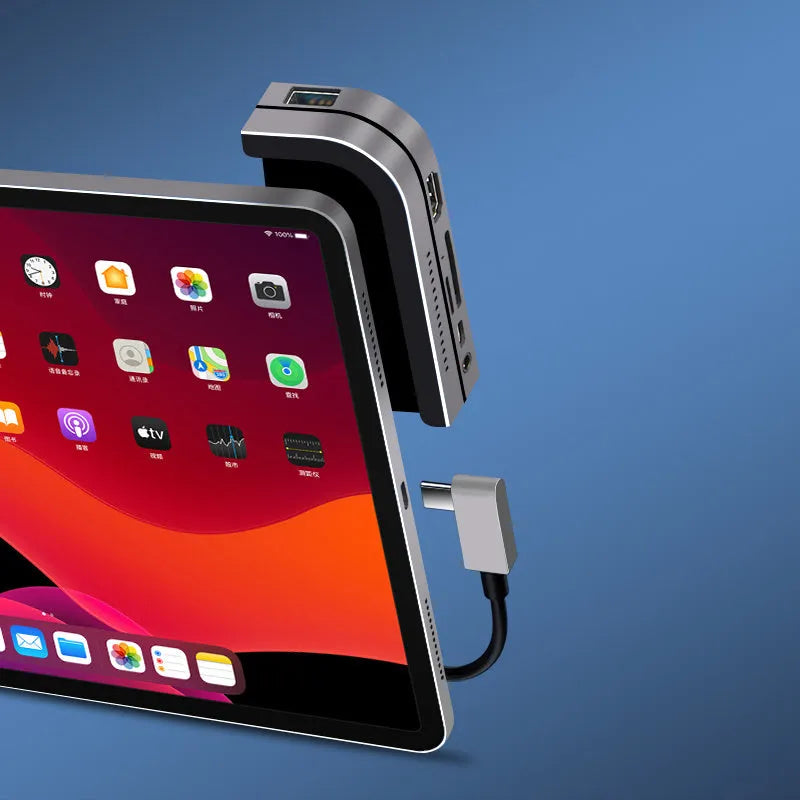 Silver aluminium grey USB-C docking station and converter hub for iPad Pro with multiple ports.