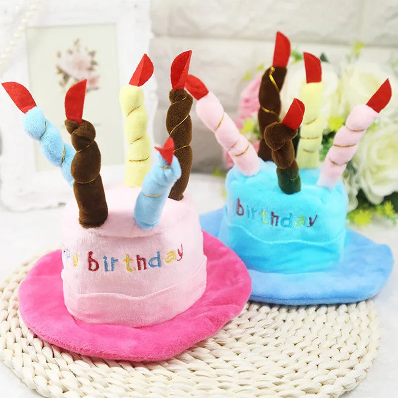 Blue and pink birthday hats for toy dogs on a festive background.