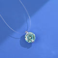 Women's sterling silver plum blossom necklace with a blue green moissanite stone on an invisible fishing line chain.