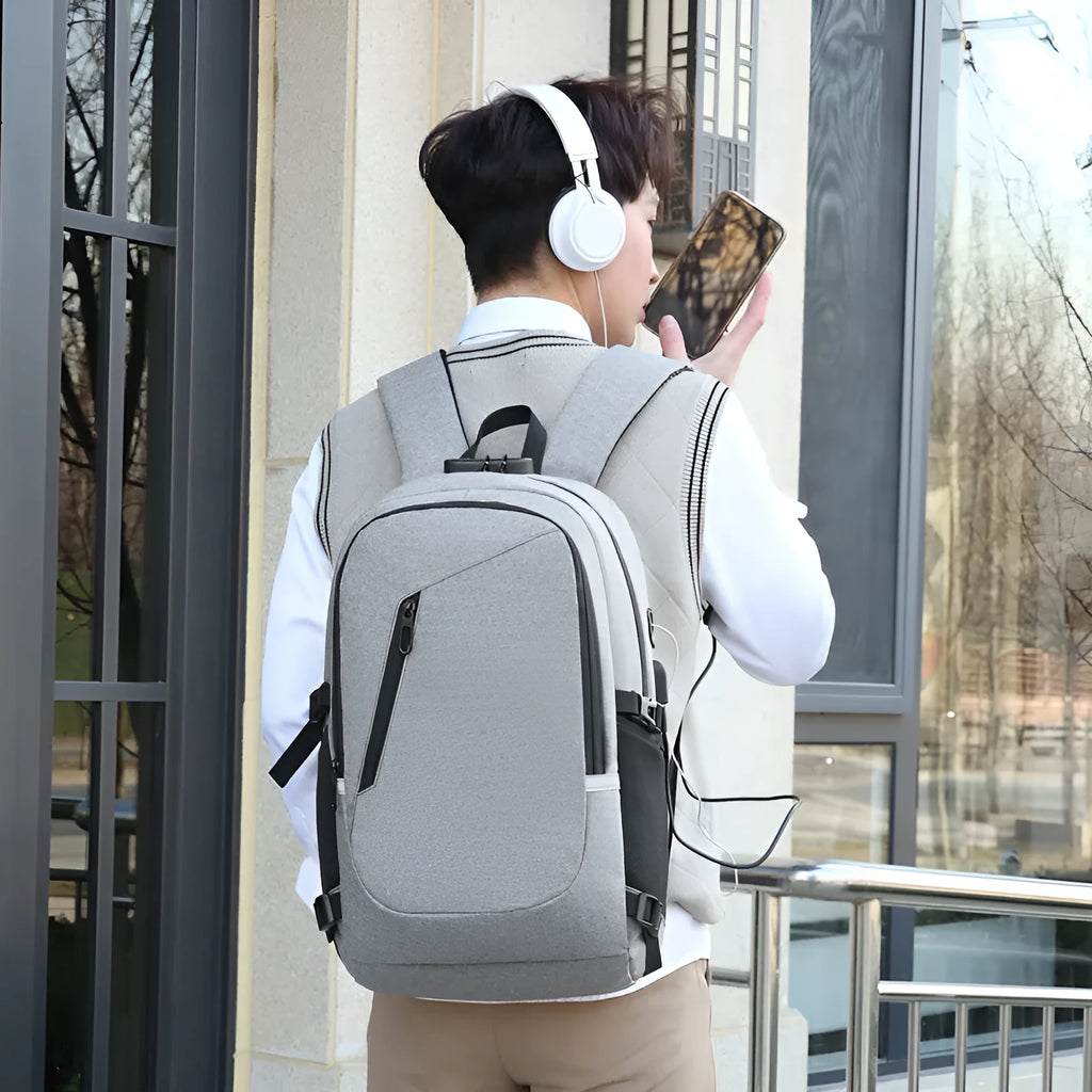Grey Oxford cloth computer backpack showing front compartment and shoulder straps