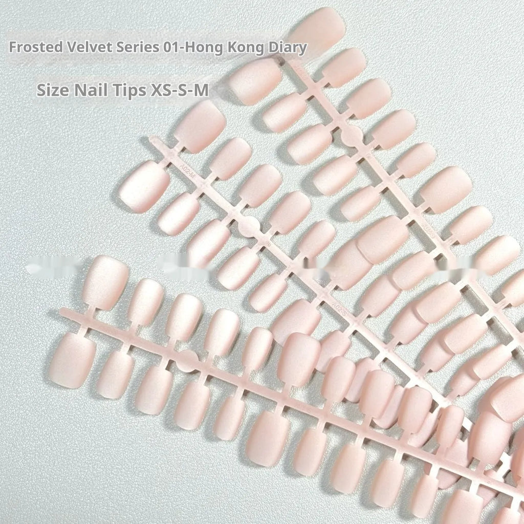 Set of frosted velvet Cat's Eye artificial nails in short ladder style on a clear background.