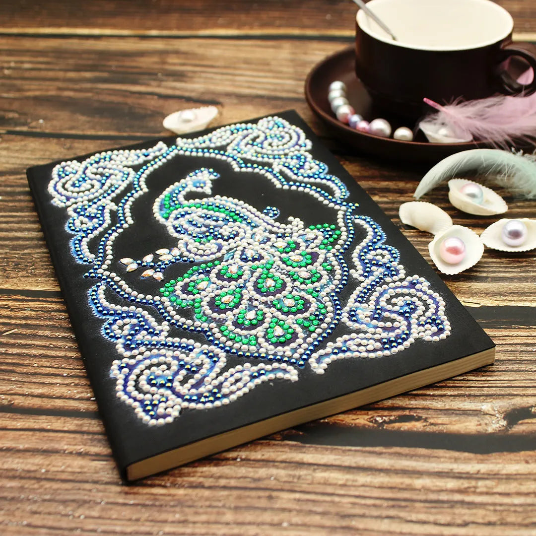 Black A5 diamond painting notebook with peacock design and rhinestone drills