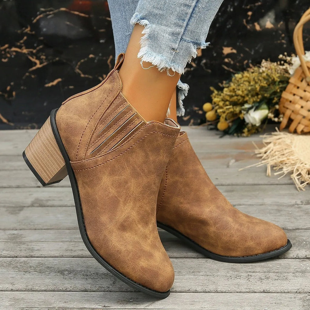 Women's black slip-on ankle boots with pointed toe and thick square heel