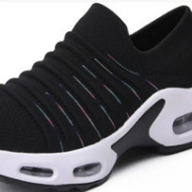 Plus size fly-knit mesh sock shoes in dark blue, showing stretch knit upper and round toe.