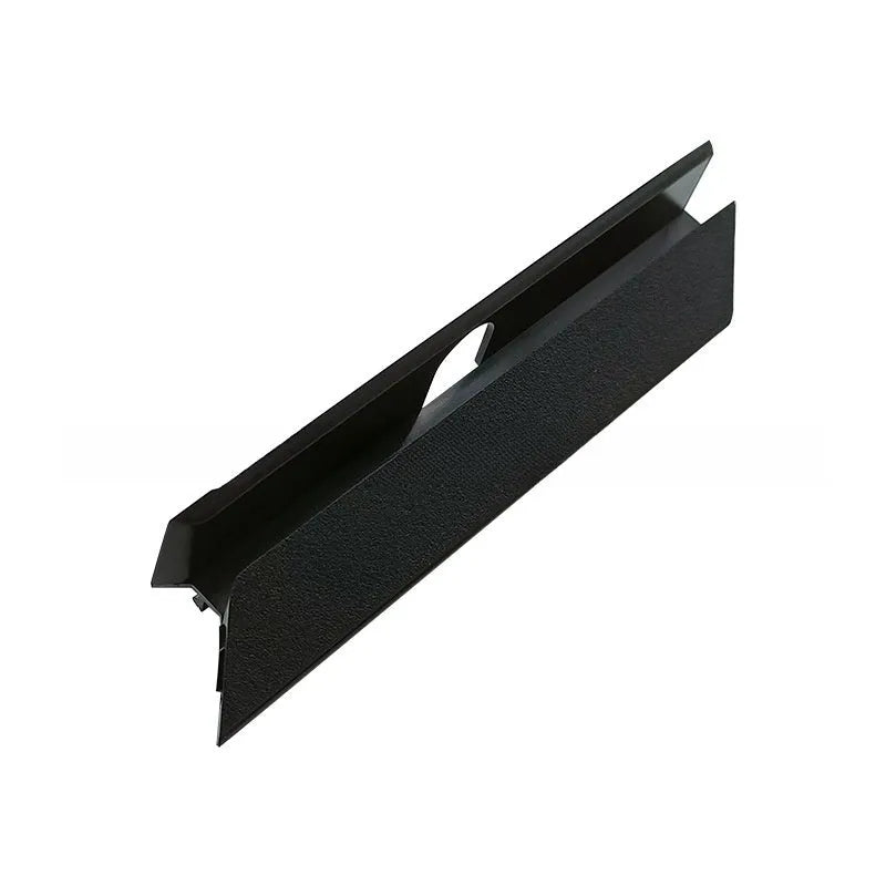 Black PS4 Pro hard drive bottom cover and small plastic repair parts including a baffle and strip.