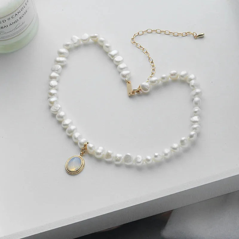 Silver necklace with round medal pendant and irregular pearl charm on adjustable 21-50cm chain