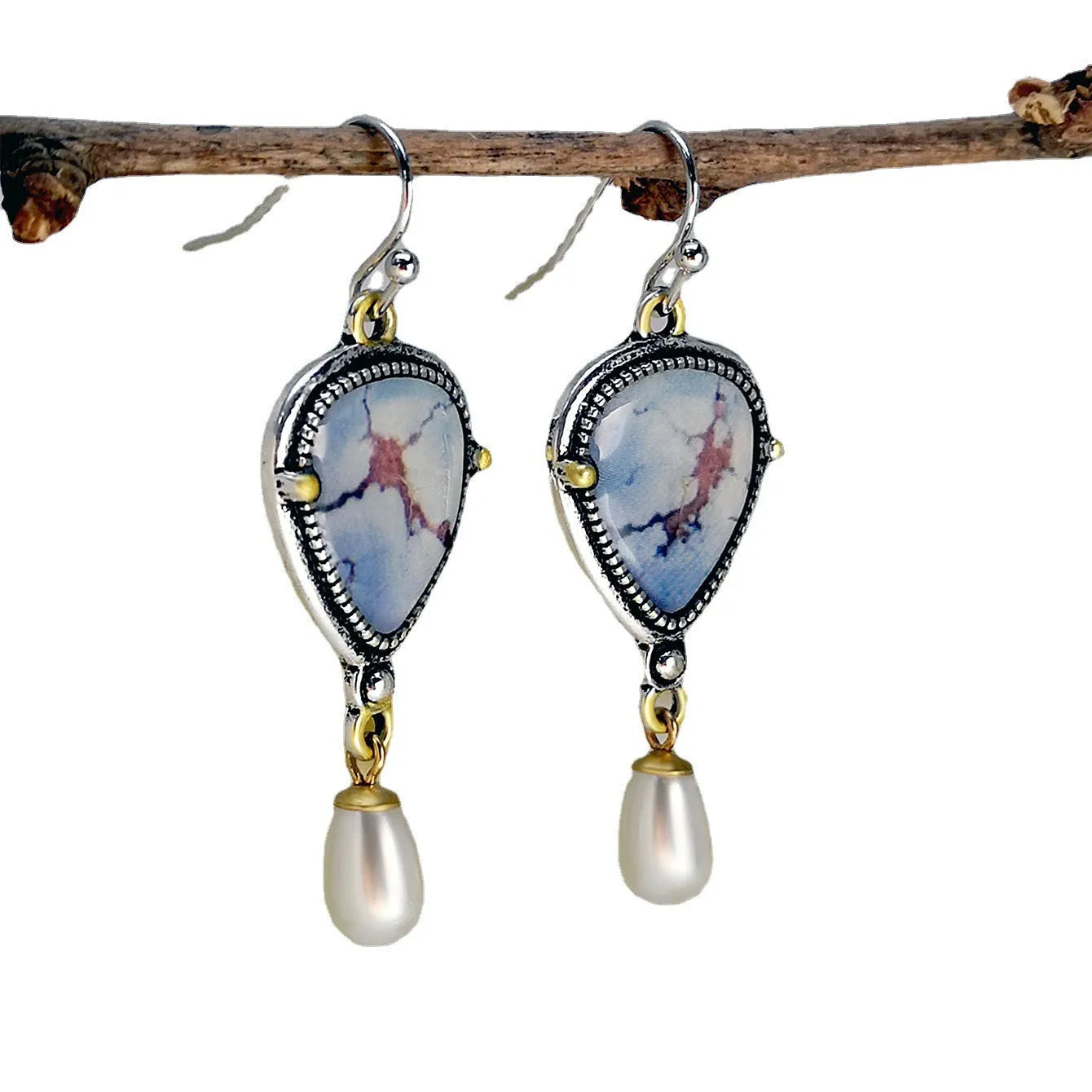 Retro blue geometric drop earrings with synthetic blue opal and white pearl on electroplated metal.