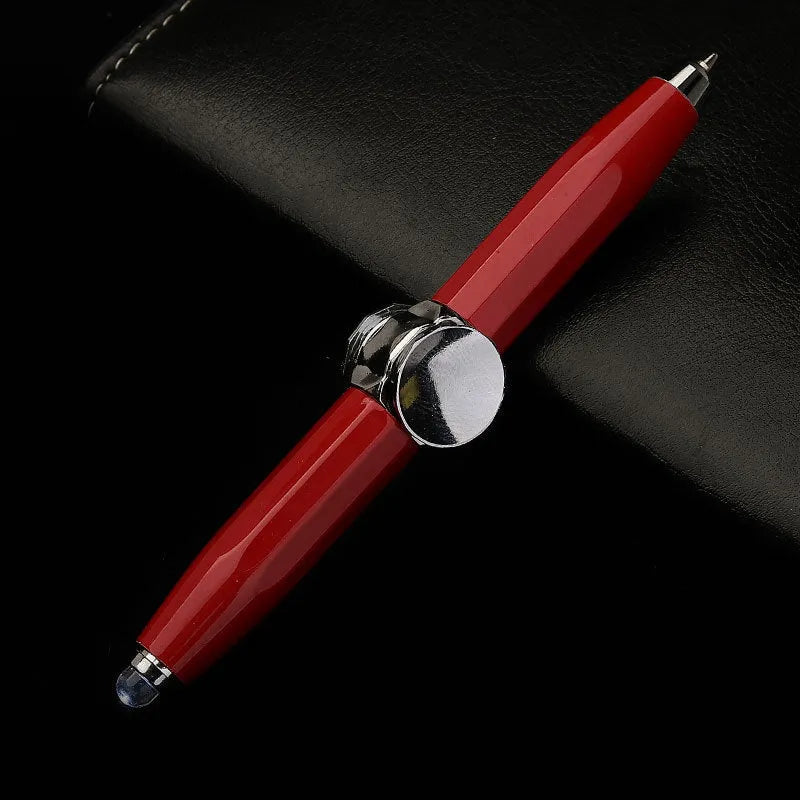 Metal LED spinning gyro ballpoint pen in hand, showing fidget spinner top and pen tip.