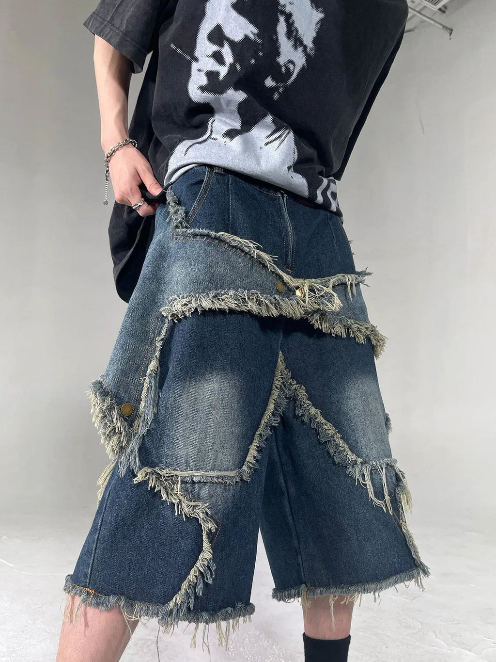 Men's blue denim shorts with frayed edges and five-pointed star design, loose fit for summer
