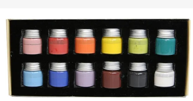 Three pots of Morandi colour ceramic glaze paint in lilac, plant ash, and verdant for high-temperature pottery.