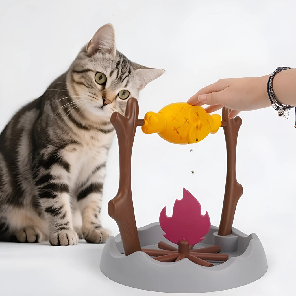 Tumbling cat food feeder toy with treats inside, showing 30cm dimensions