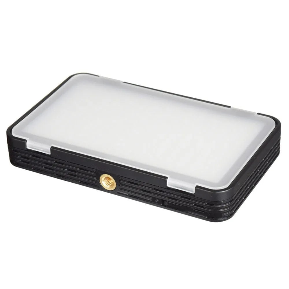 Slim silver Shenniu M150 LED video light with bracket on a mobile phone.