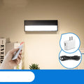 White rechargeable magnetic LED desk lamp with large light surface on a wooden desk.