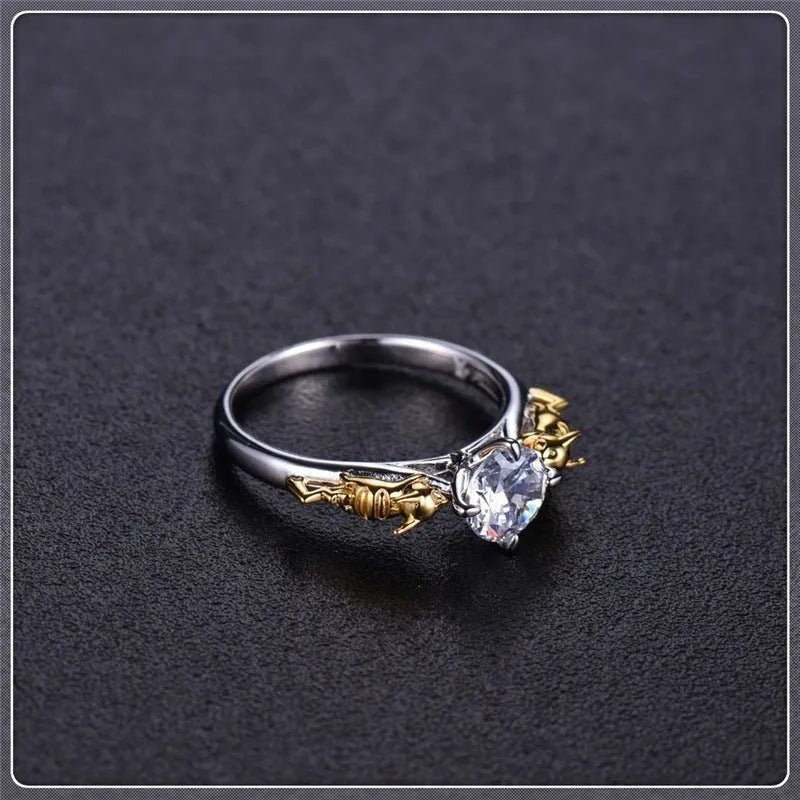 Copper crown fashion ring with black gold crystal centrepiece shown in individual packaging