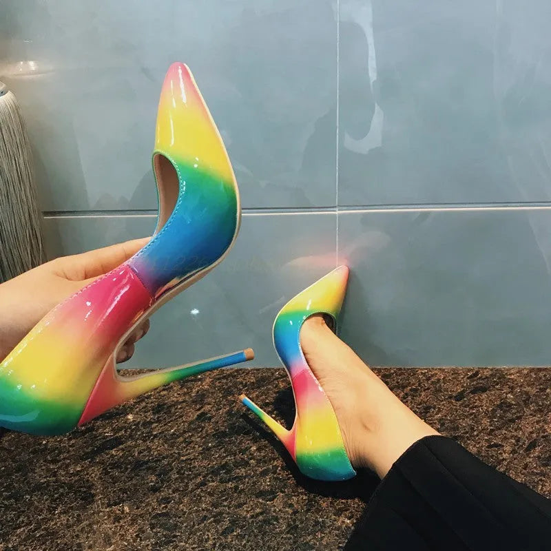 Rainbow glossy patent leather women's high heel shoes with pointed toe and thin high heel.