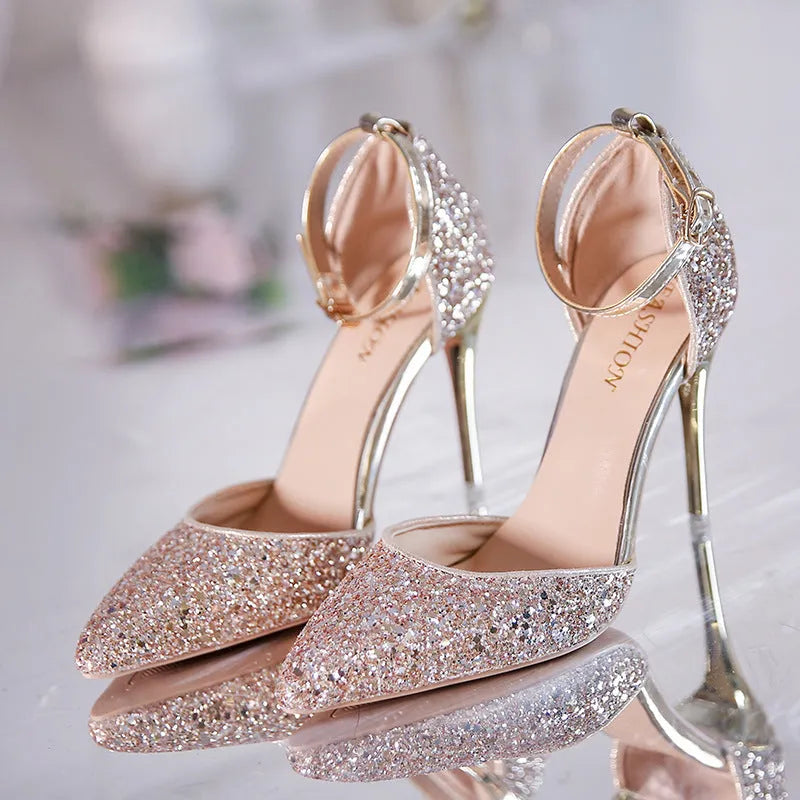 Gold and silver stiletto heel pumps with beaded and belt decoration on a solid-colour upper