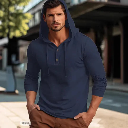 Man wearing a dark blue cotton pullover hoodie top with long sleeves, showing loose casual fit.