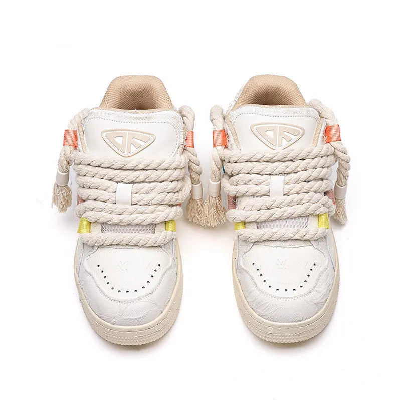 Creamy white retro skate shoes with low platform sole and lace-up design