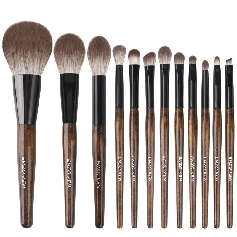 12-piece makeup brush set with wooden handles stored in black PU roll-up case