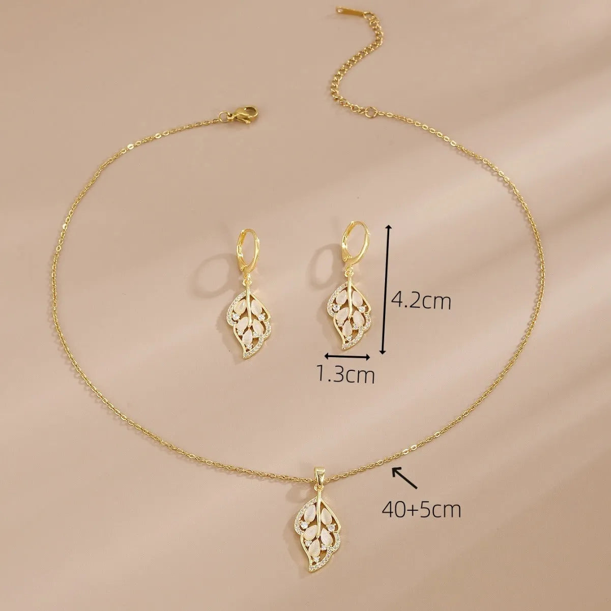 Opal leaves copper electroplated necklace and earrings set on display