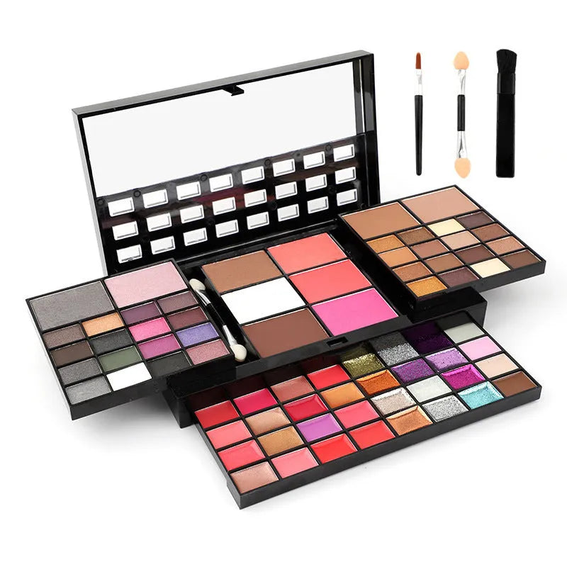74 colour makeup palette open showing eyeshadow, lip gloss, blush and contour powders with brush and applicator